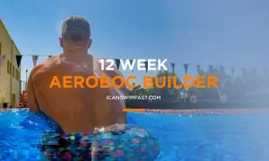 Man in pool, ready for 12-week aerobic swim sets.