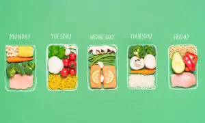 A week's worth of healthy meals for a half ironman nutrition plan, featuring chicken, salmon, vegetables, and grains for each day.