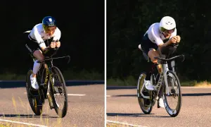 Two athletes on time trial bikes, part of a triathlon, race on a sunny road.