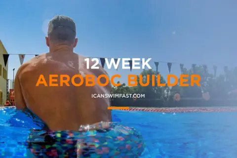 Man in pool, ready for 12-week aerobic swim sets.