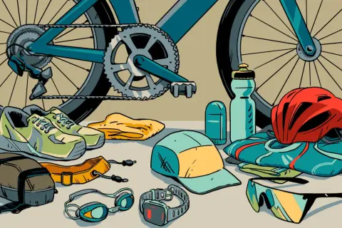 Ready for a triathlon! Cycling shoes, goggles, a helmet, sunglasses, and a water bottle are laid out with a bike.