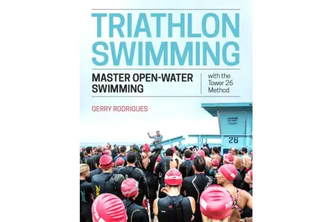 Cover of "Triathlon Swimming" book, featuring a group of swimmers in wetsuits preparing for an open-water event.