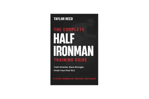 Book cover for "The Complete Half Ironman Training Guide" by Taylor Reed, featuring a cyclist silhouette and training advice.