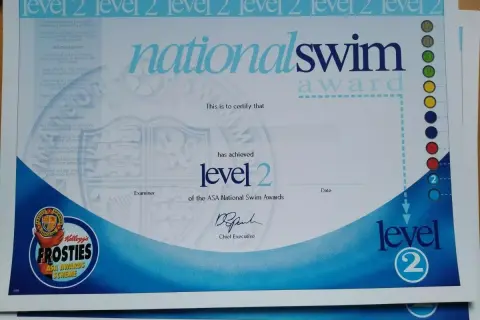 A swim certificate for National Swim Award Level 2, featuring Kellogg's Frosties ASA Awards Scheme.