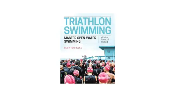 Book cover for "Triathlon Swimming" by Gerry Rodrigues, featuring a crowd of swimmers in wetsuits and caps preparing for open-water training.