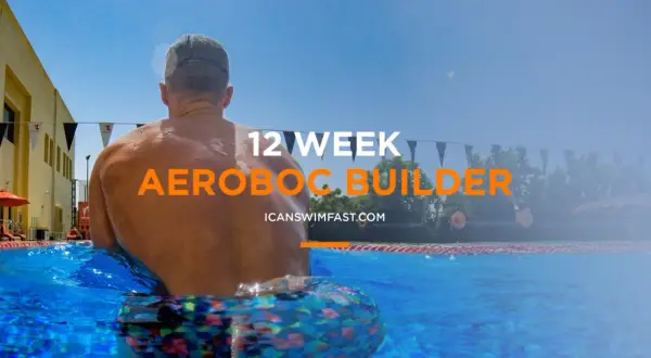Man in pool, ready for 12-week aerobic swim sets.