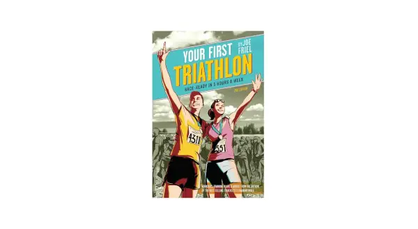 Book cover: "Your First Triathlon" by Joe Friel. A man and woman celebrate finishing a race, offering a guide on how to train for a triathlon.