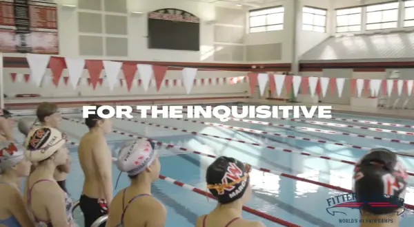 Young swimmers in a pool, ready for competitive swim lessons. The text "FOR THE INQUISITIVE" is prominent.