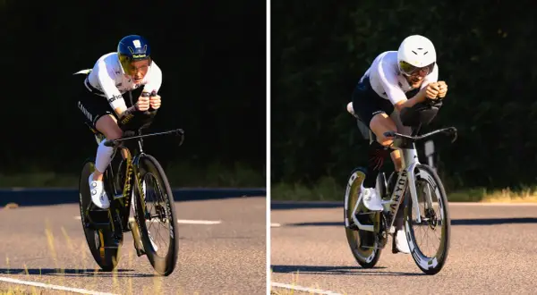 Two athletes on time trial bikes, part of a triathlon, race on a sunny road.