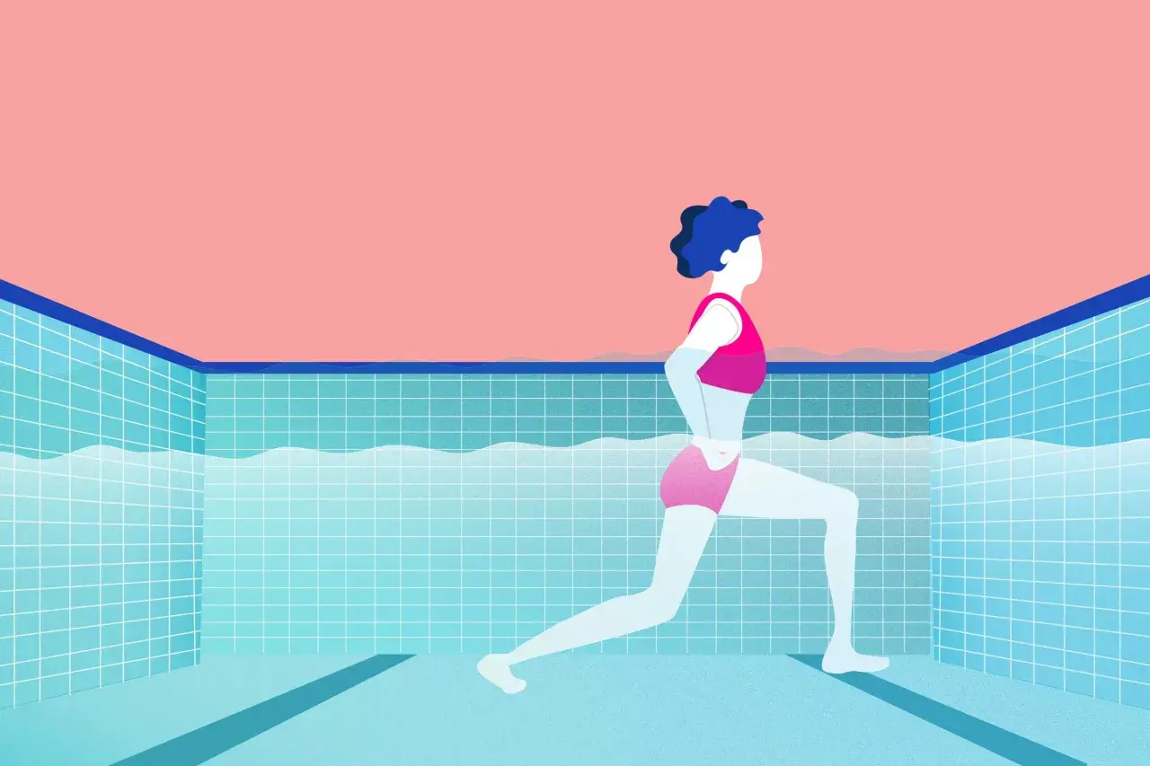 A person in pink swimwear performs a lunge in a tiled pool, showcasing effective swim fitness.