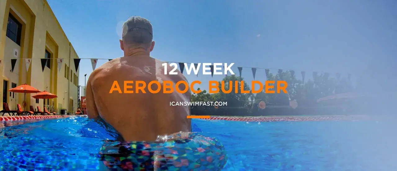 Man in pool, ready for 12-week aerobic swim sets.