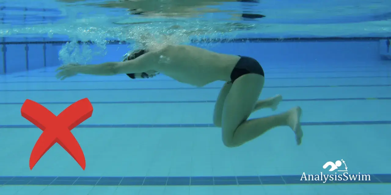 A swimmer demonstrates an incorrect breaststroke kick, with knees splayed outwards. A red X marks the error.