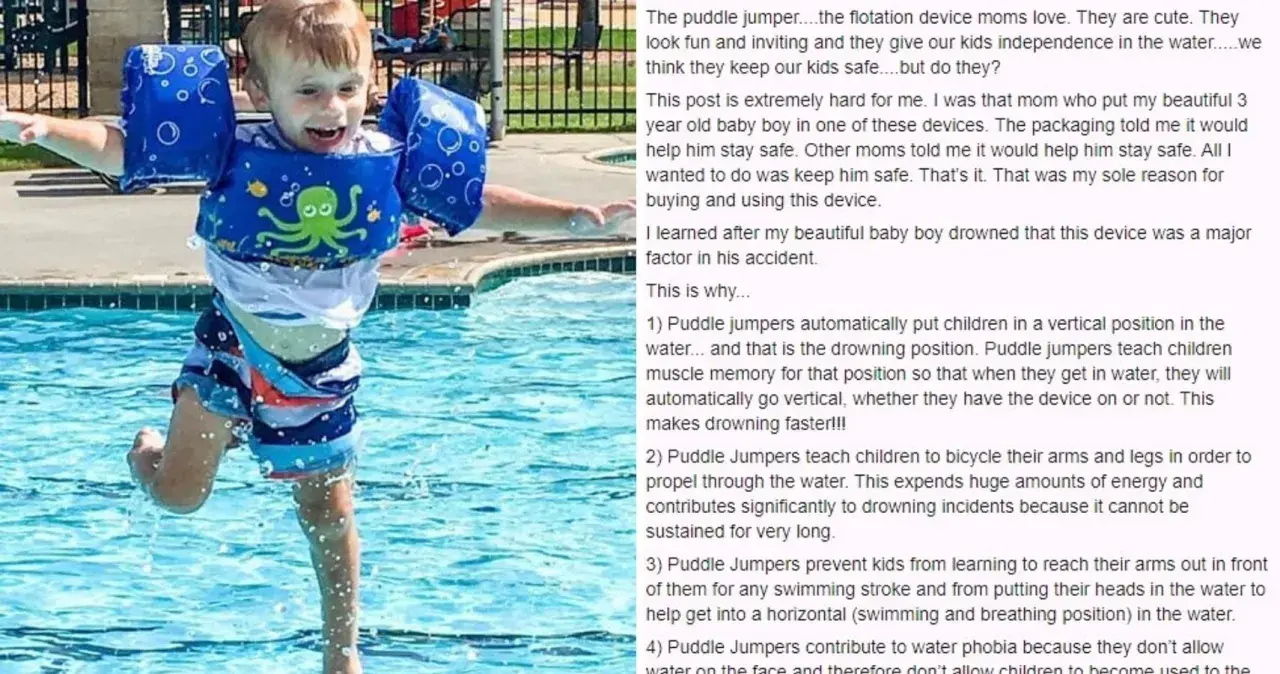 A happy boy in a blue puddle jumper with an octopus design splashes in a pool.