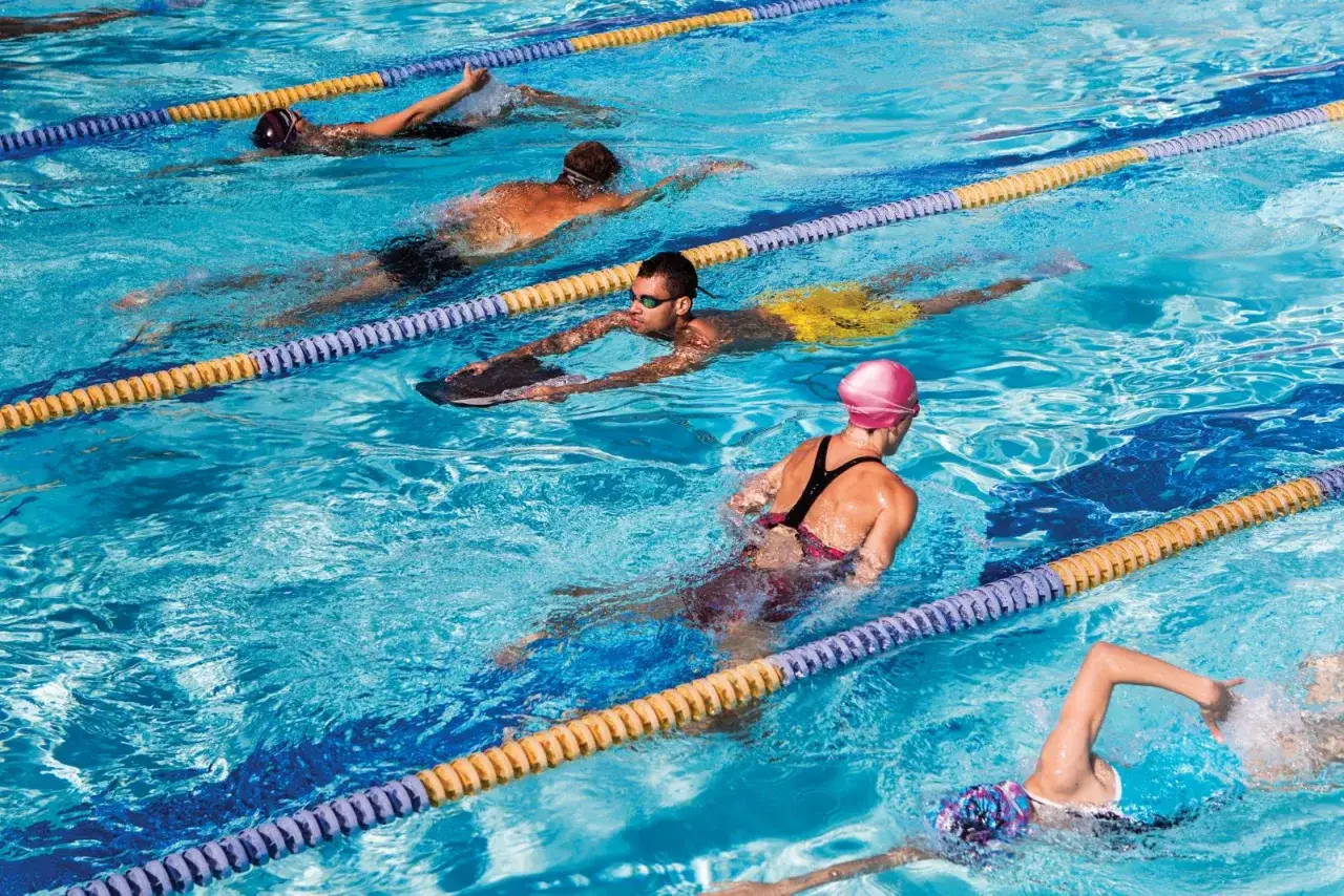 Swimmers train in lanes, a great way to see how many calories do you burn in the pool.