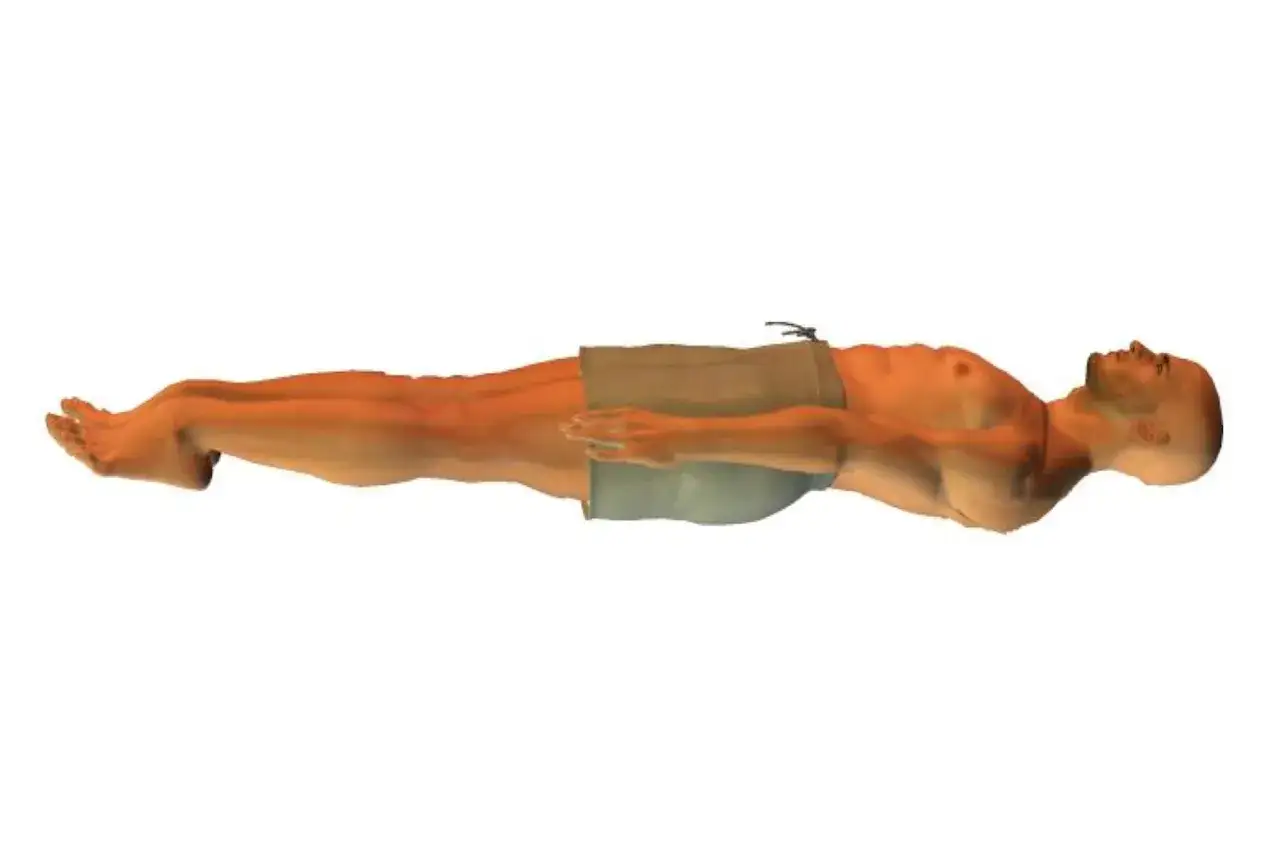 A man floats horizontally, arms crossed over his chest, in a perfect back stroke position.