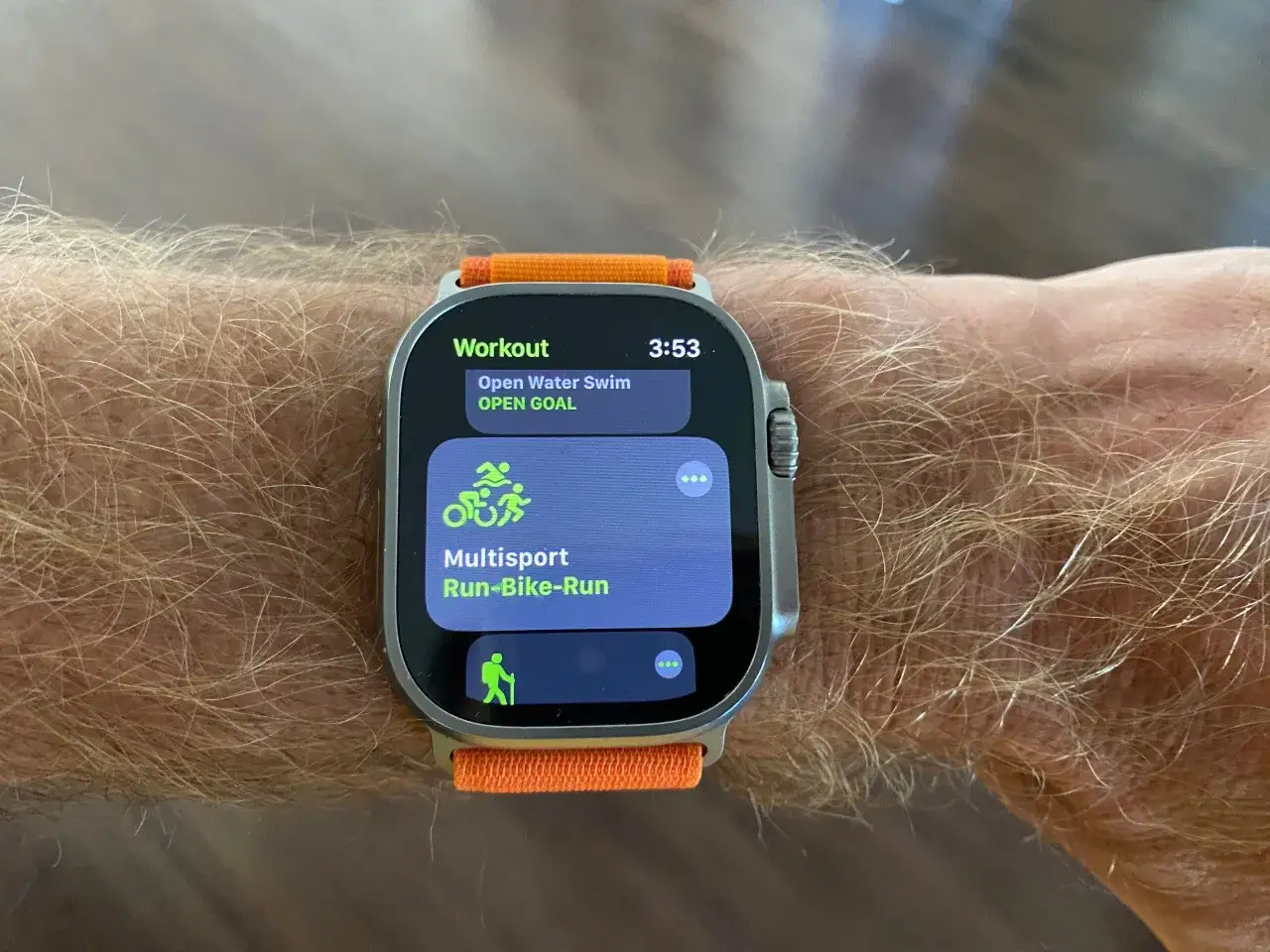 Apple Watch Ultra showing Multisport workout options for triathlon training: Open Water Swim and Run-Bike-Run.