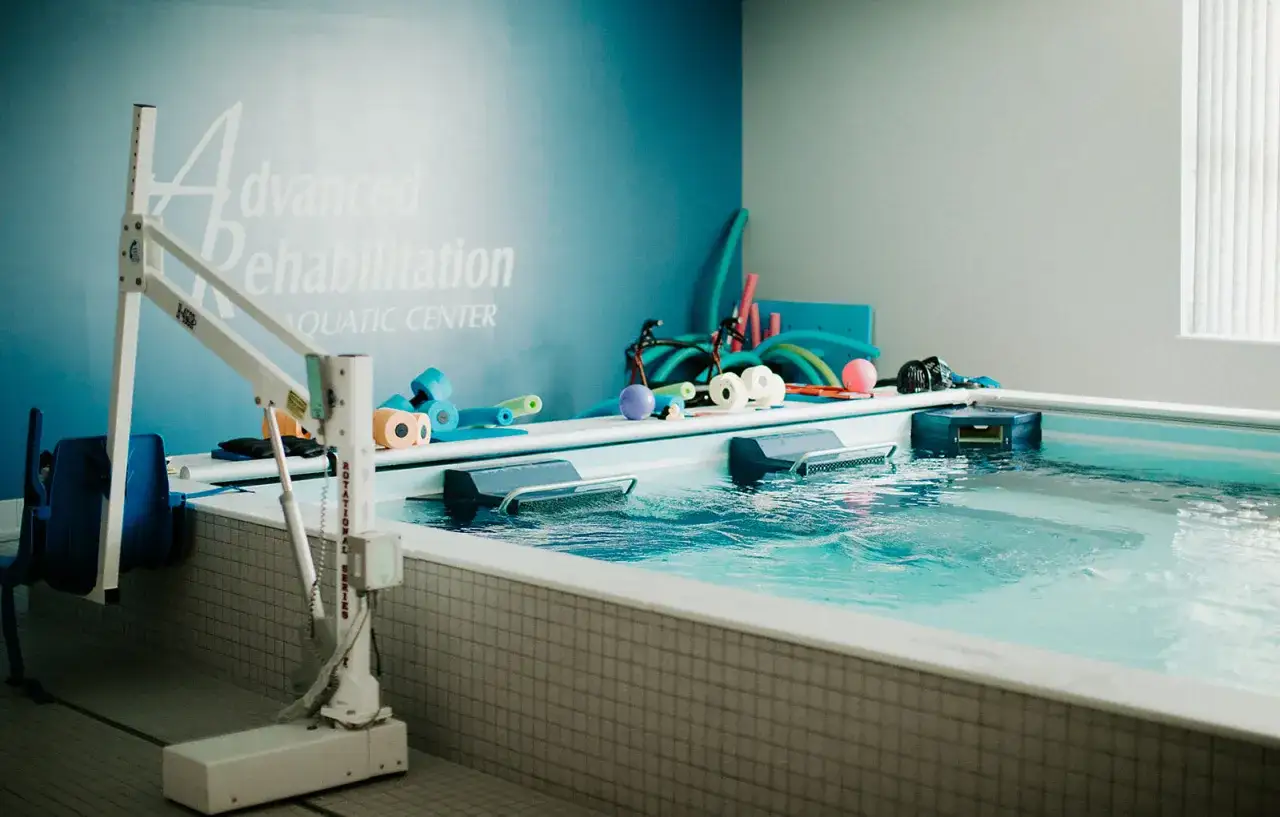 Aquatic therapy pool with rehabilitation equipment. Ask your doctor how long after hernia surgery can you swim.