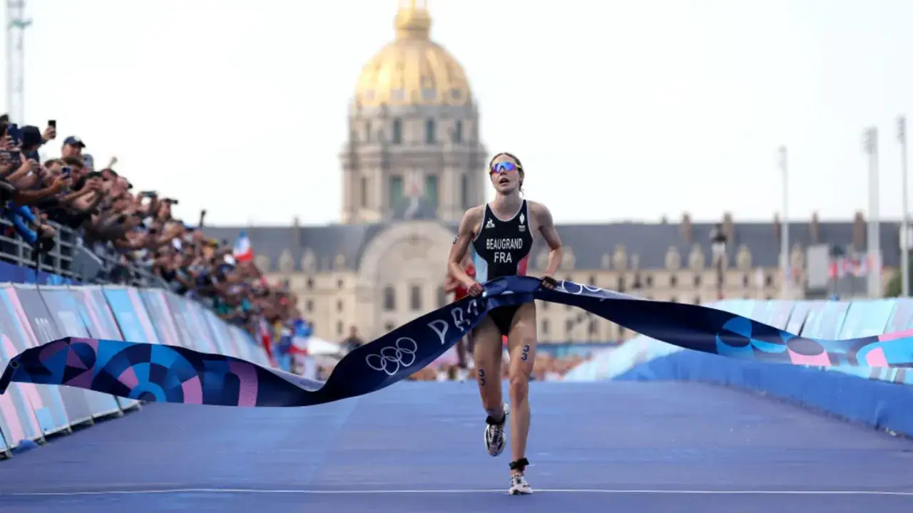 Cassandre Beaugrand crosses the finish line, breaking the tape in a triumphant moment.