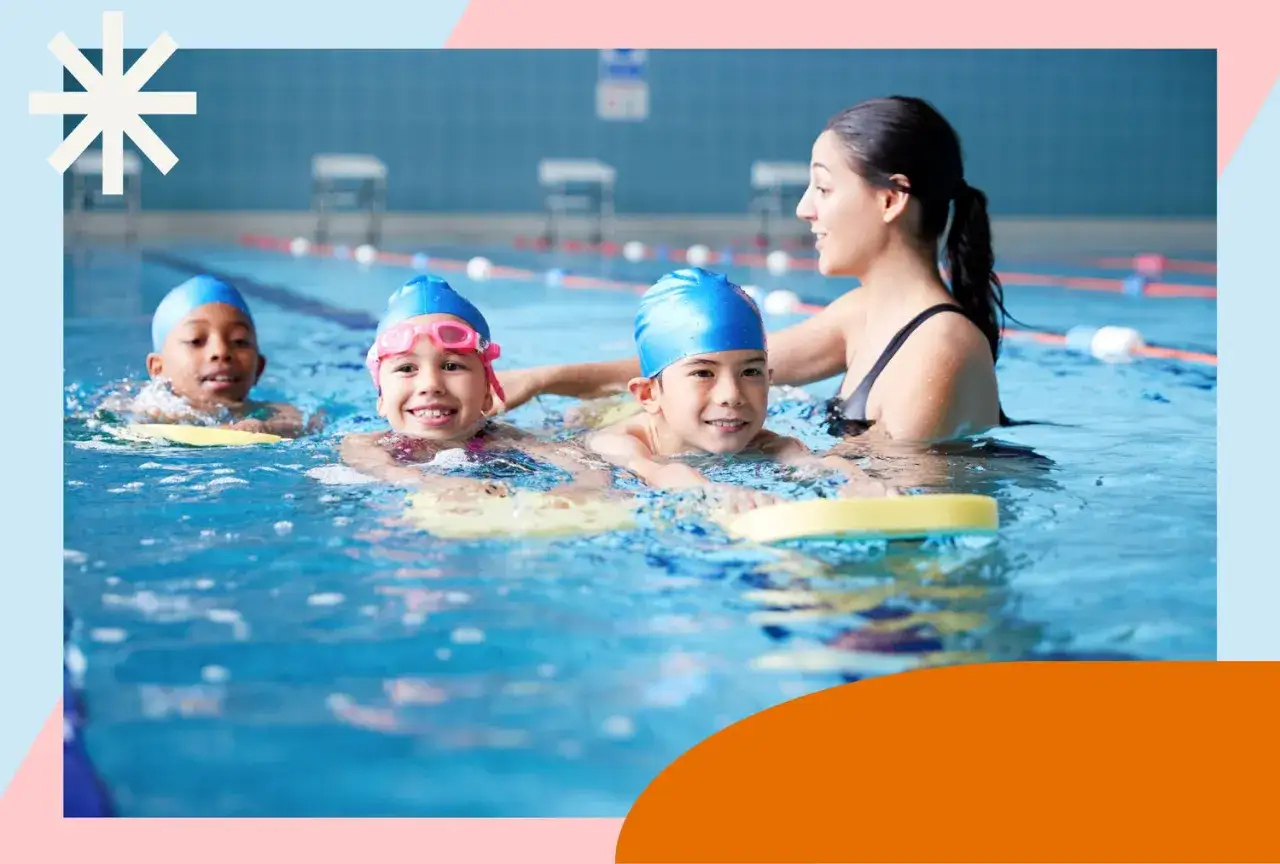A swim instructor helps young children learn to swim. It's never too early to start lessons!