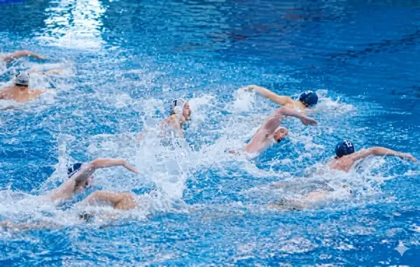 Intense water polo periods with athletes battling for the ball amidst splashing water.