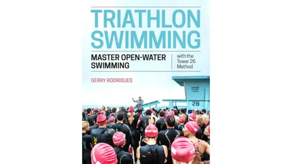 Cover of "Triathlon Swimming" book, featuring a group of swimmers in wetsuits preparing for an open-water event.