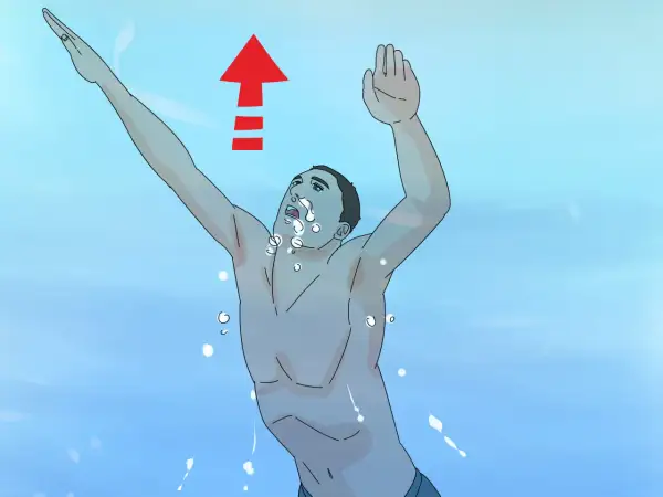 A swimmer demonstrates how to breathe in water, with an upward arrow indicating movement. Bubbles surround their face.