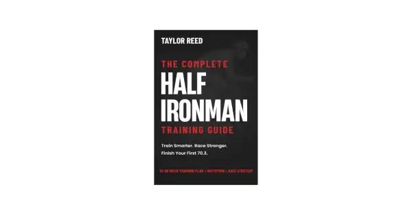Book cover for "The Complete Half Ironman Training Guide" by Taylor Reed, featuring a cyclist silhouette and training advice.