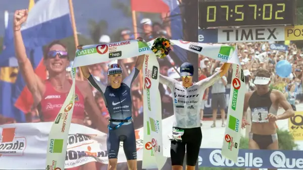 Two athletes celebrate crossing the finish line, one holding a bouquet, achieving their fastest Ironman time.